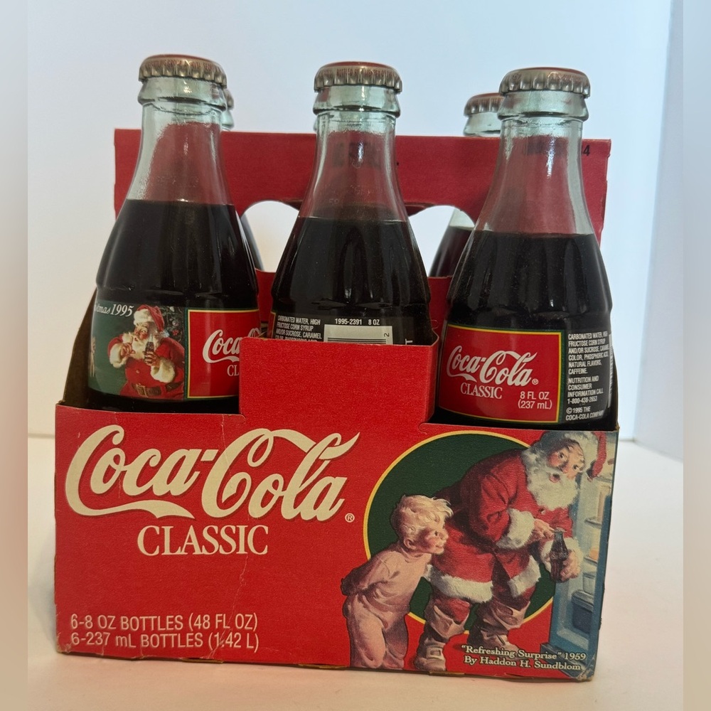 Coca Cola 6pk 1995 holiday bottles.